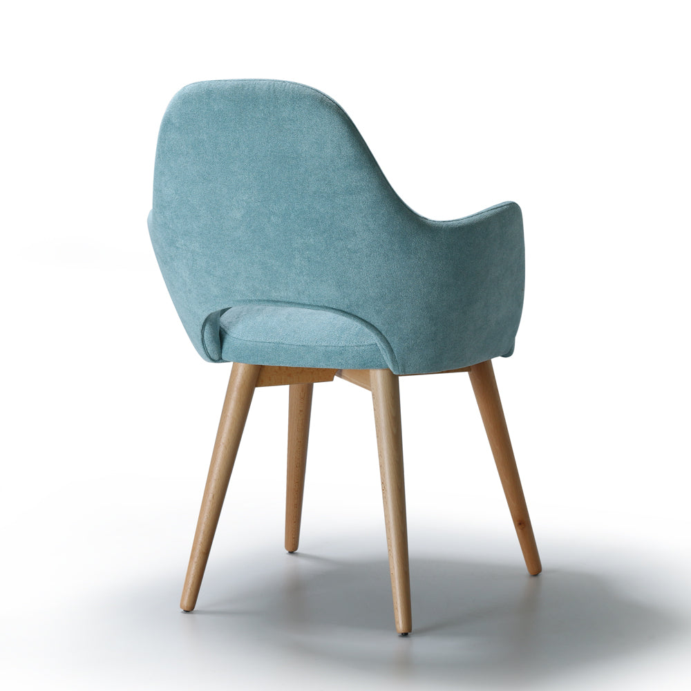 Back view of blue Andre chair with wooden legs on a white background