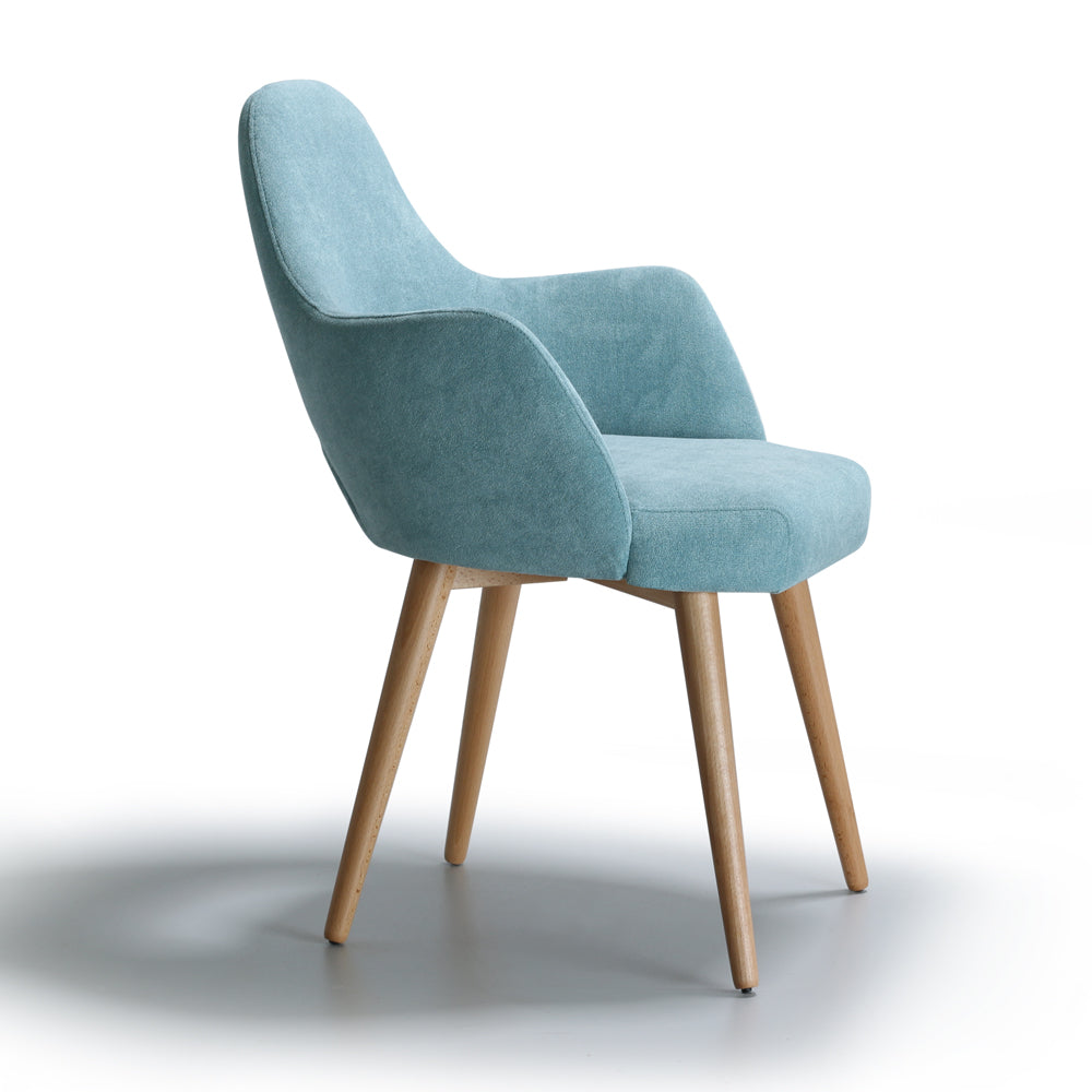 Side view of blue Andre chair with wooden legs on a white background