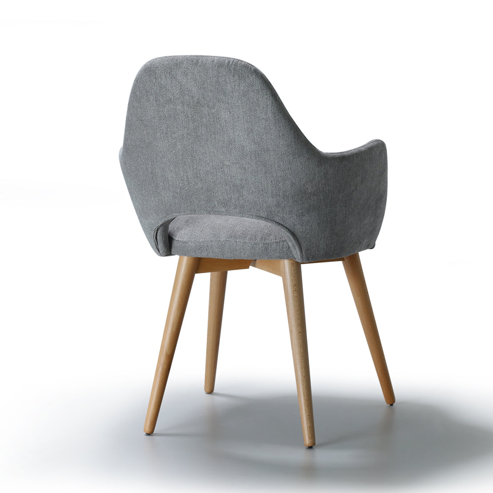 Back view of gray upholstered Andre chair with wooden legs on a white background