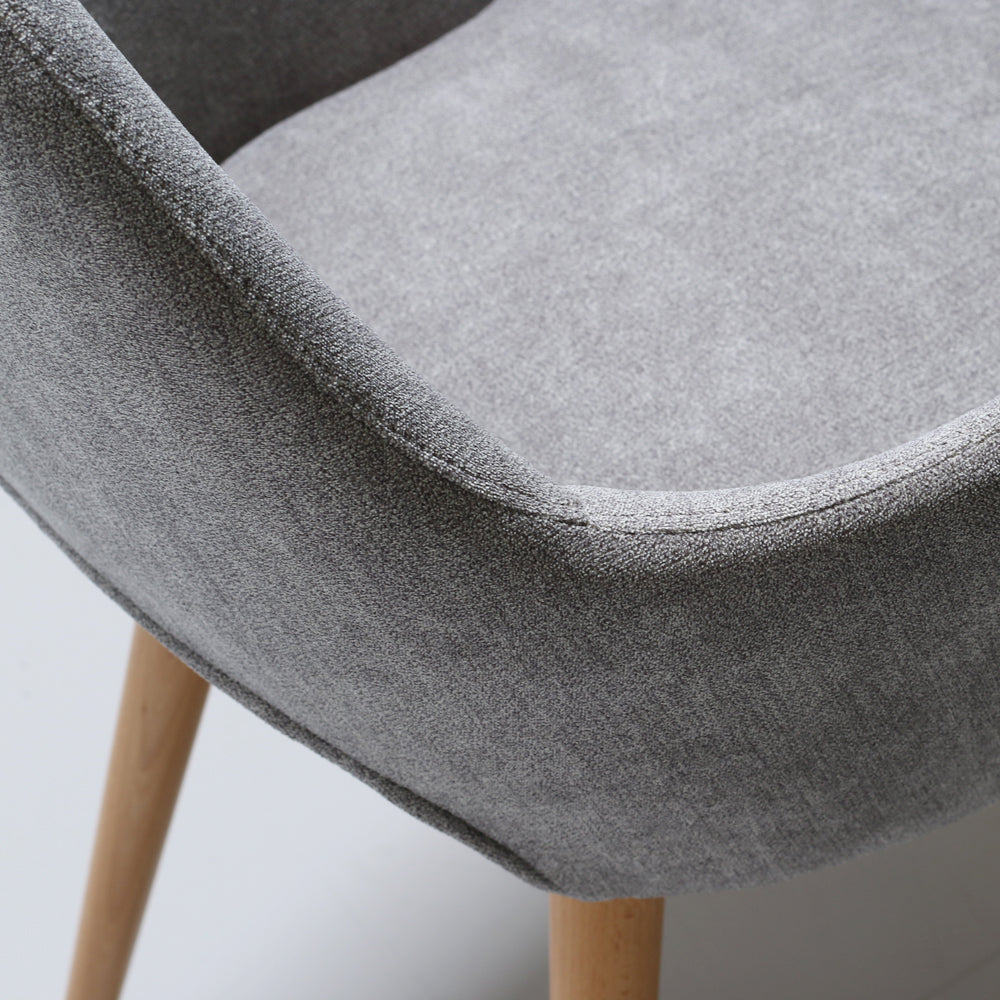 Back view of gray upholstered Andre chair with wooden legs on a white background