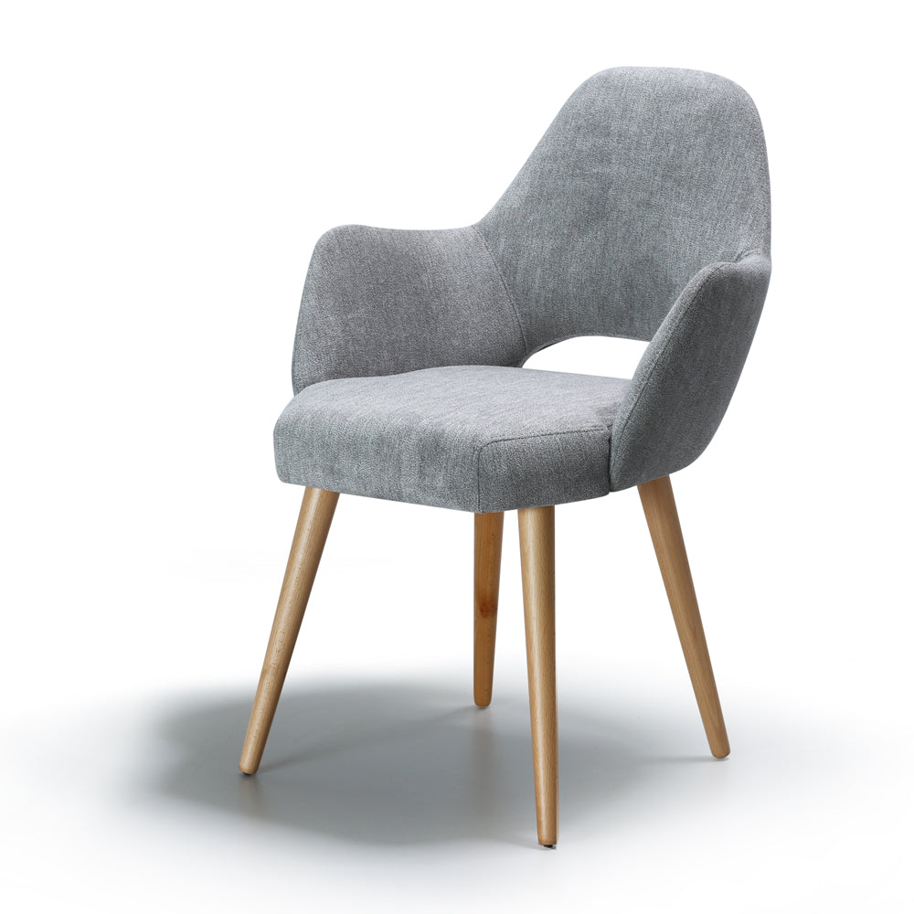Side view of gray upholstered chair Andre with wooden legs on a white background
