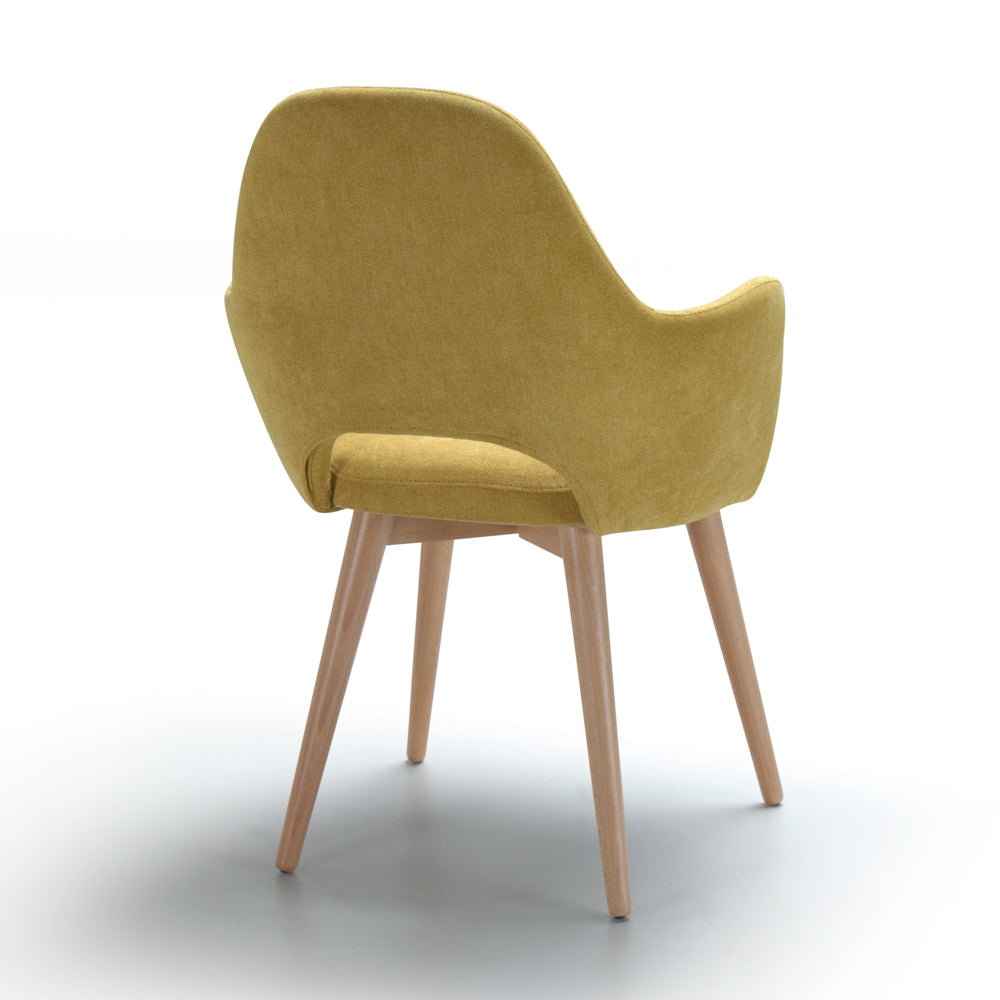 Back view of yellow Andre chair with wooden legs on a white background