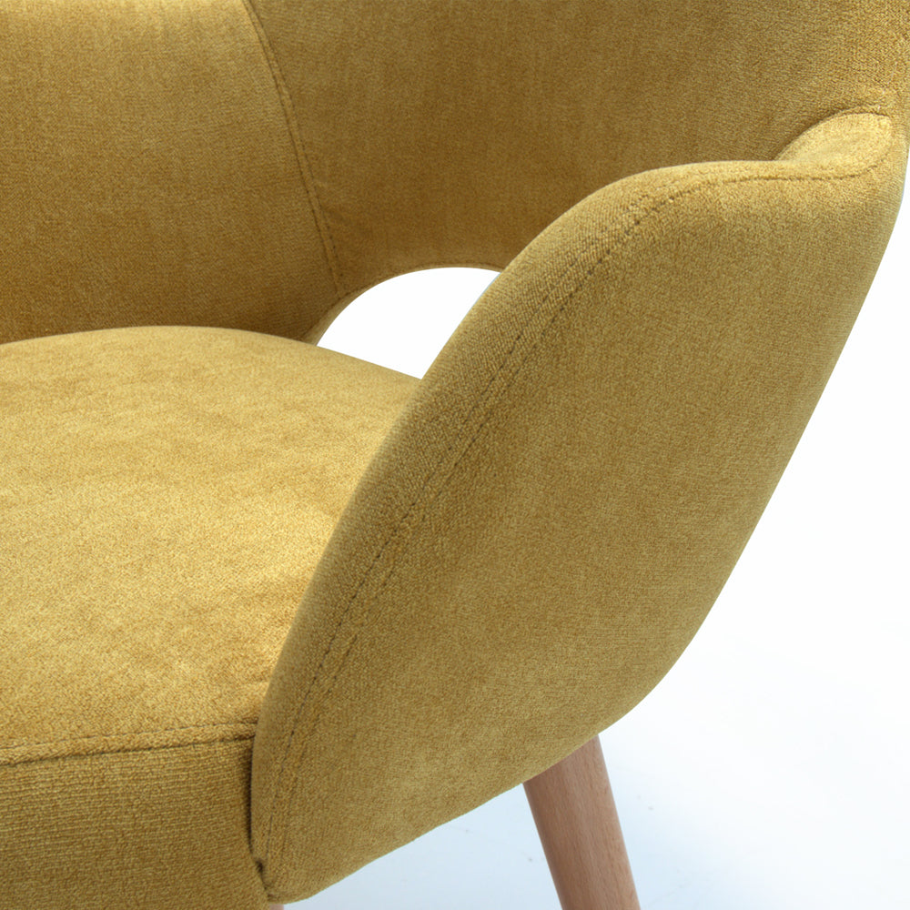 Close-up of a yellow chair Andre with a white background