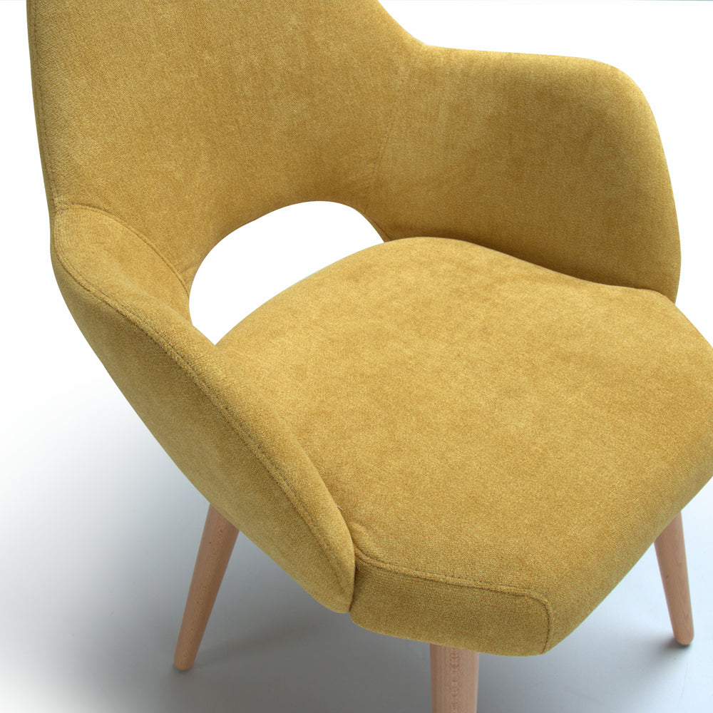 Top view of yellow chair Andre with wooden legs on a white background