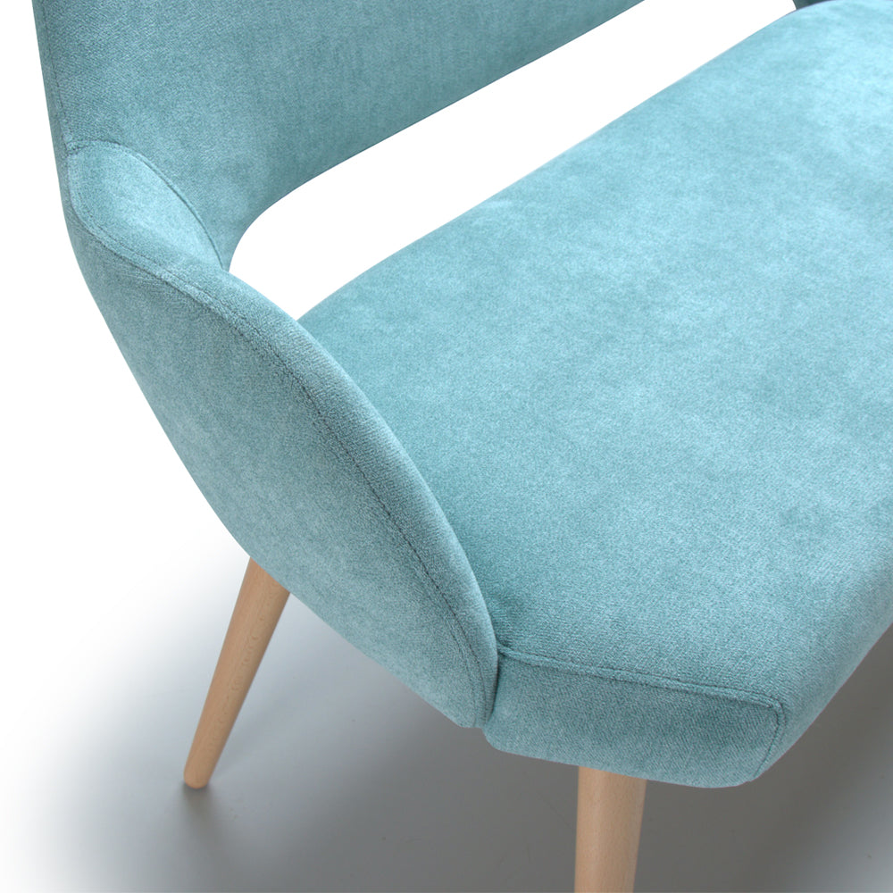 Light blue upholstered Andre sofa with wooden legs on a white background