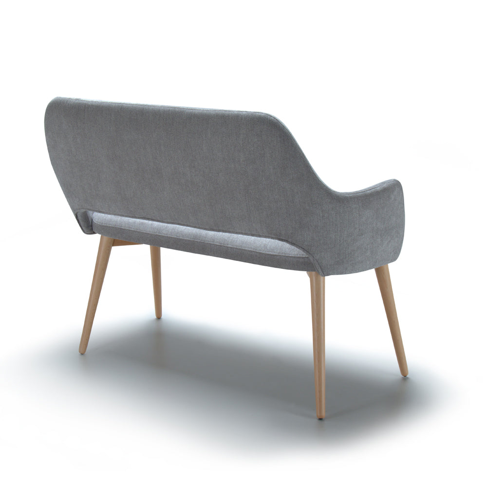 Back view of gray upholstered Andre sofa with wooden legs on a white background