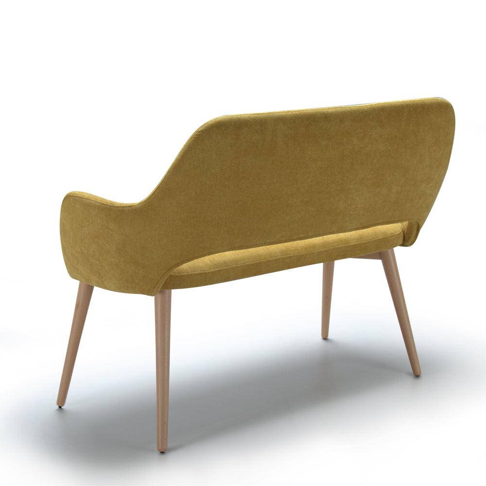Back view of yellow Andre sofa with wooden legs on a white background