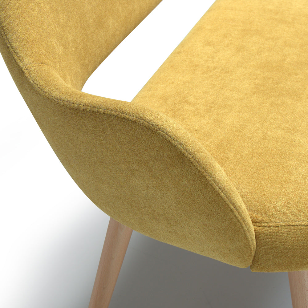 Yellow Andre sofa with wooden legs on a white background