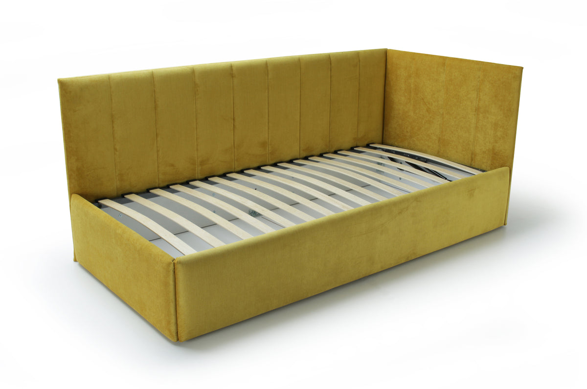 A modern corner bed featuring a yellow upholstered base and two yellow backrests tables with vertical stitched detailing. The bed is equipped with a lifting metal slatted frame -revealing a large storage compartment underneath - and is presented against a white background.
