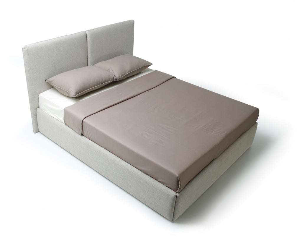 Top view of a modern platform bed with a light beige upholstered base and headboard, featuring a brown mattress and matching pillows, shown on a white background.