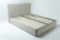 A large  beige upholstered bed frame with a tall headboard and wooden slats, shown on a white background.