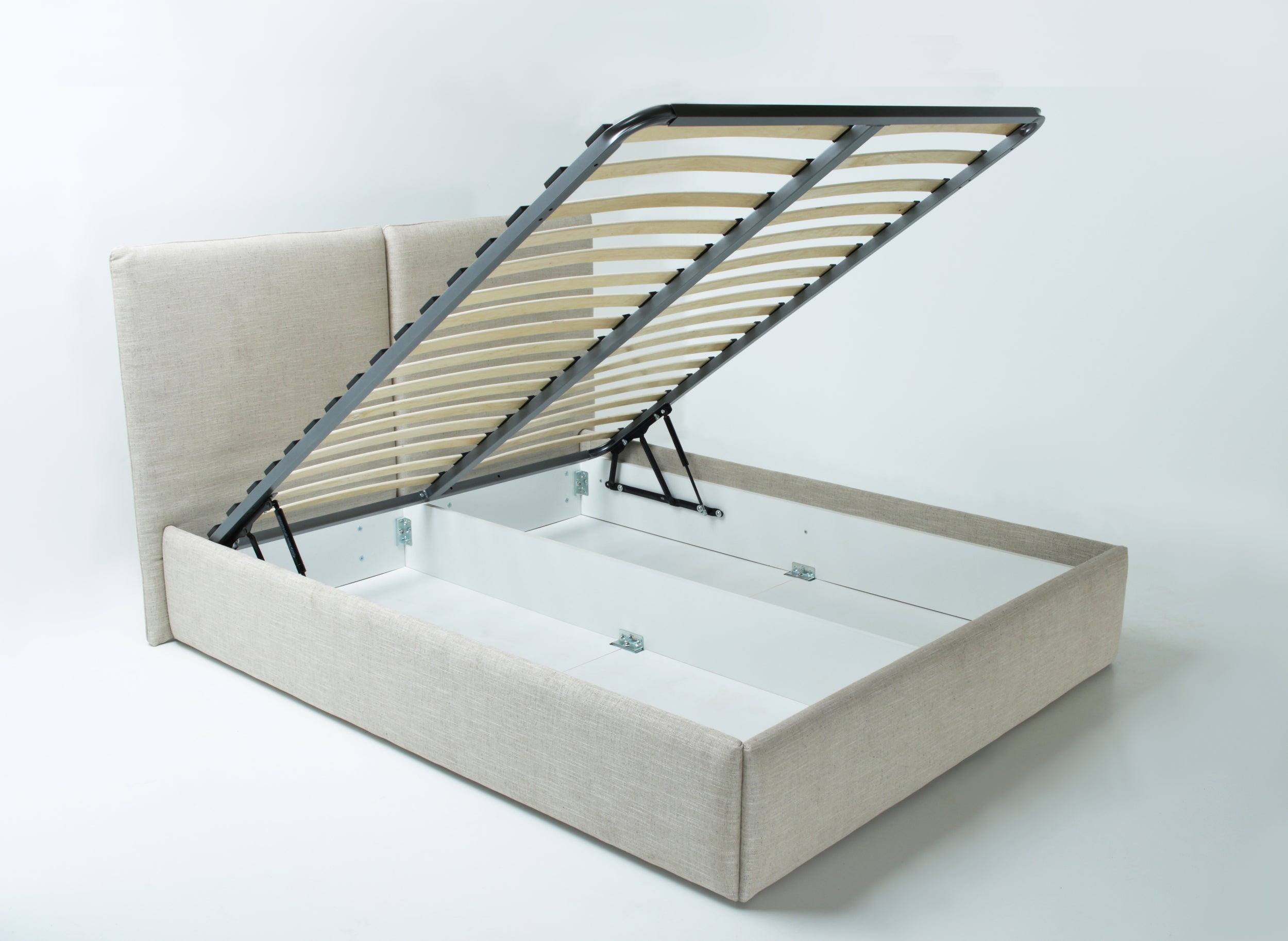 An upholstered storage bed with a lift-up slatted headboard, shown open to reveal the spacious bed frame and white mattress insert against a light gray studio background.