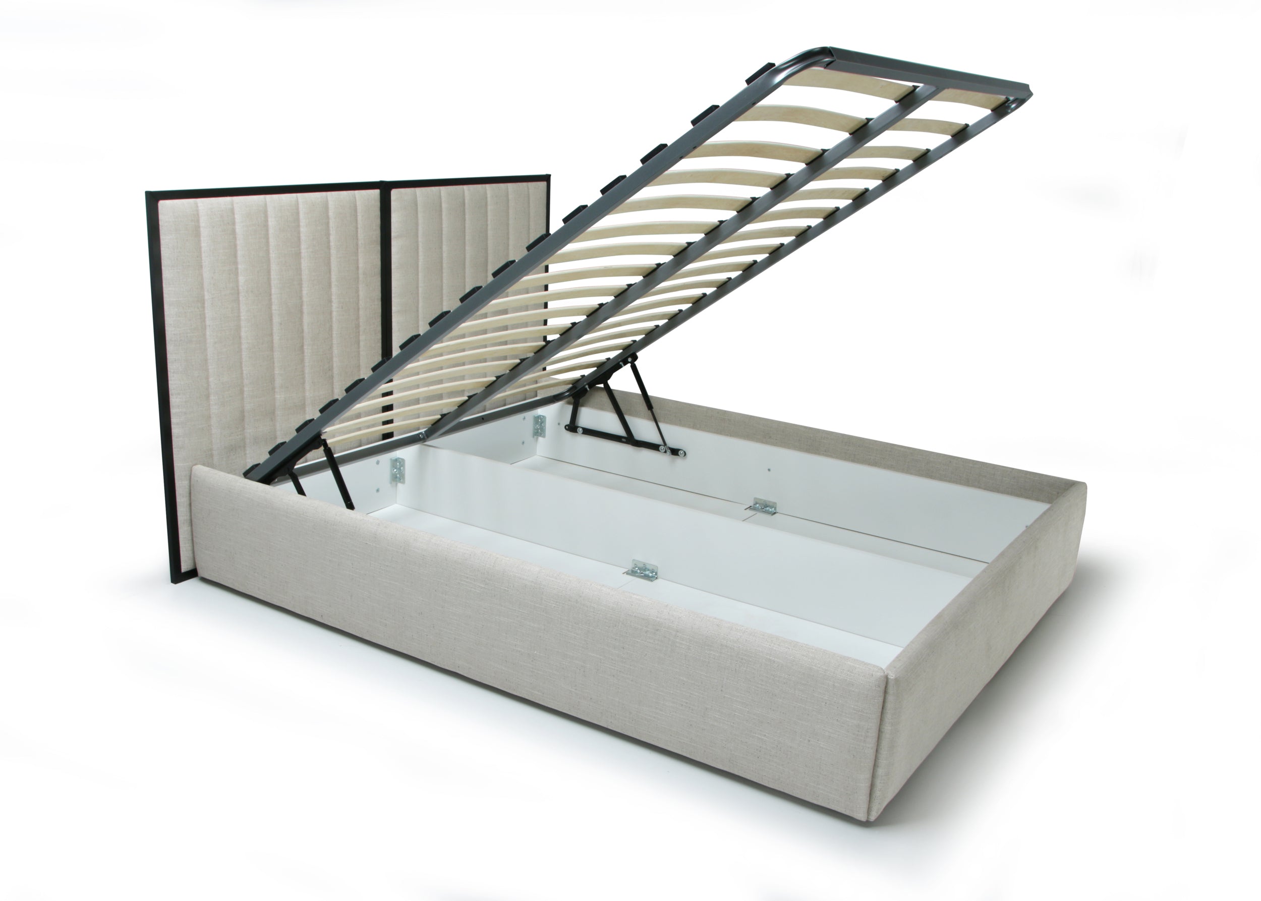 An upholstered storage bed with a lift-up slatted frame, shown open to reveal the spacious bed frame and white storage compartment underneath. The headboard is vertically slatted with a tufted panel design, and the entire bed frame is upholstered in a light beige fabric.