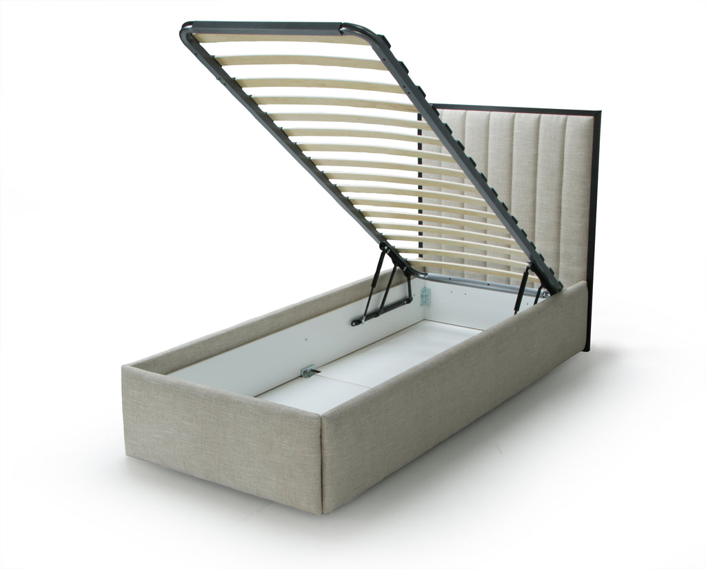 Beige upholstered bed with open storage compartment on a white background