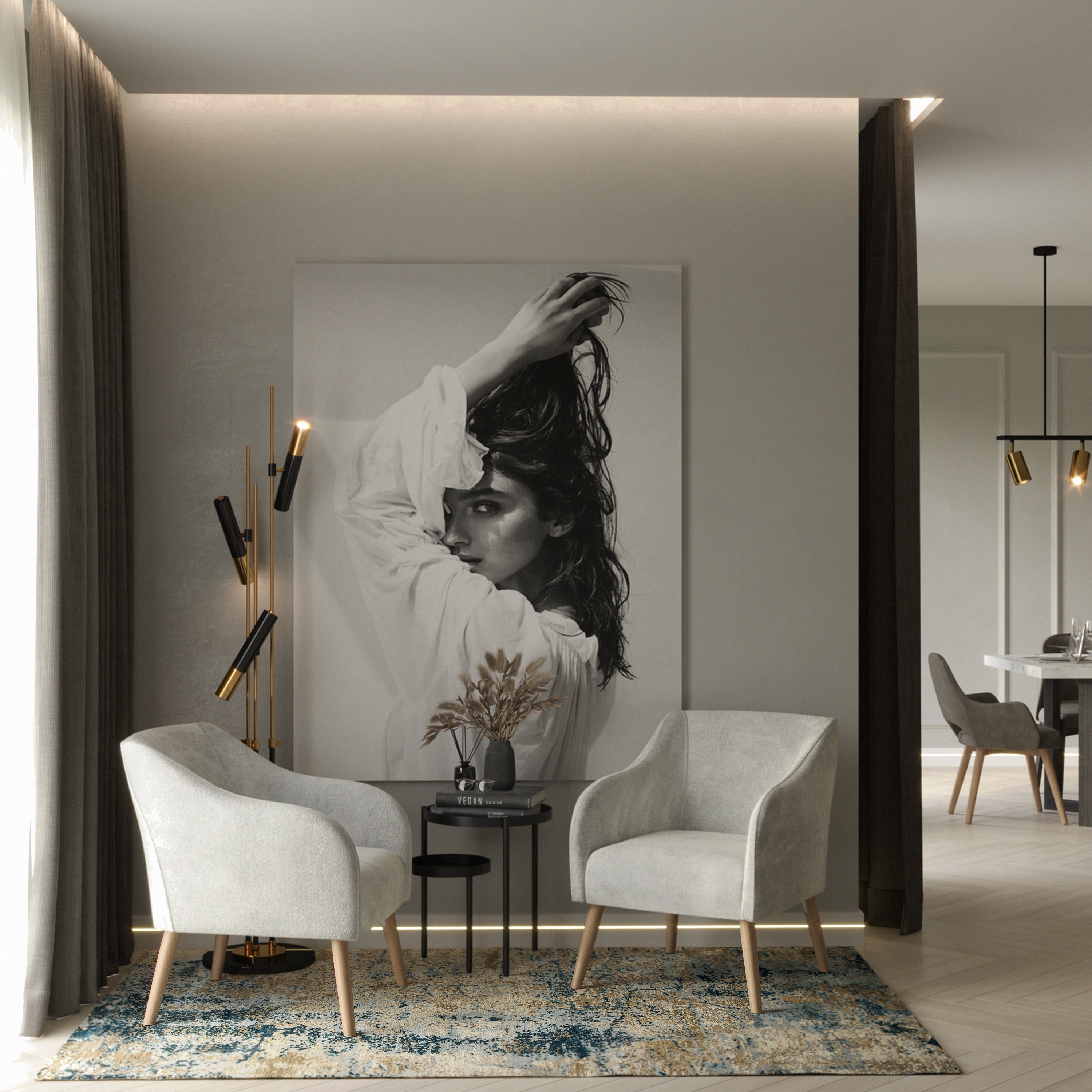 Juno armchairs in front of modern living room with a large wall art piece of a woman's face. 