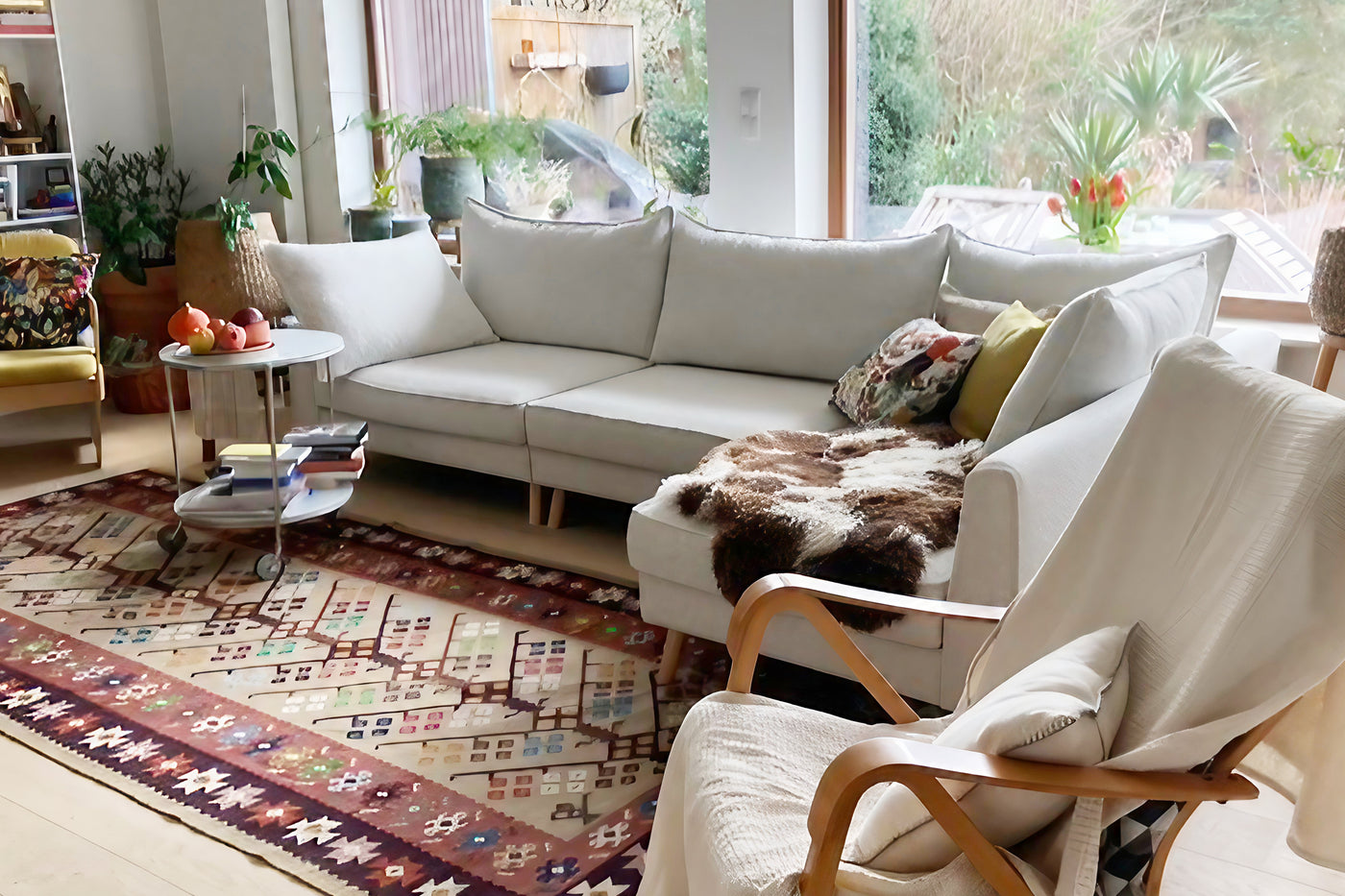Living room with a white Lucas sofa, armchair, and decorative items.
